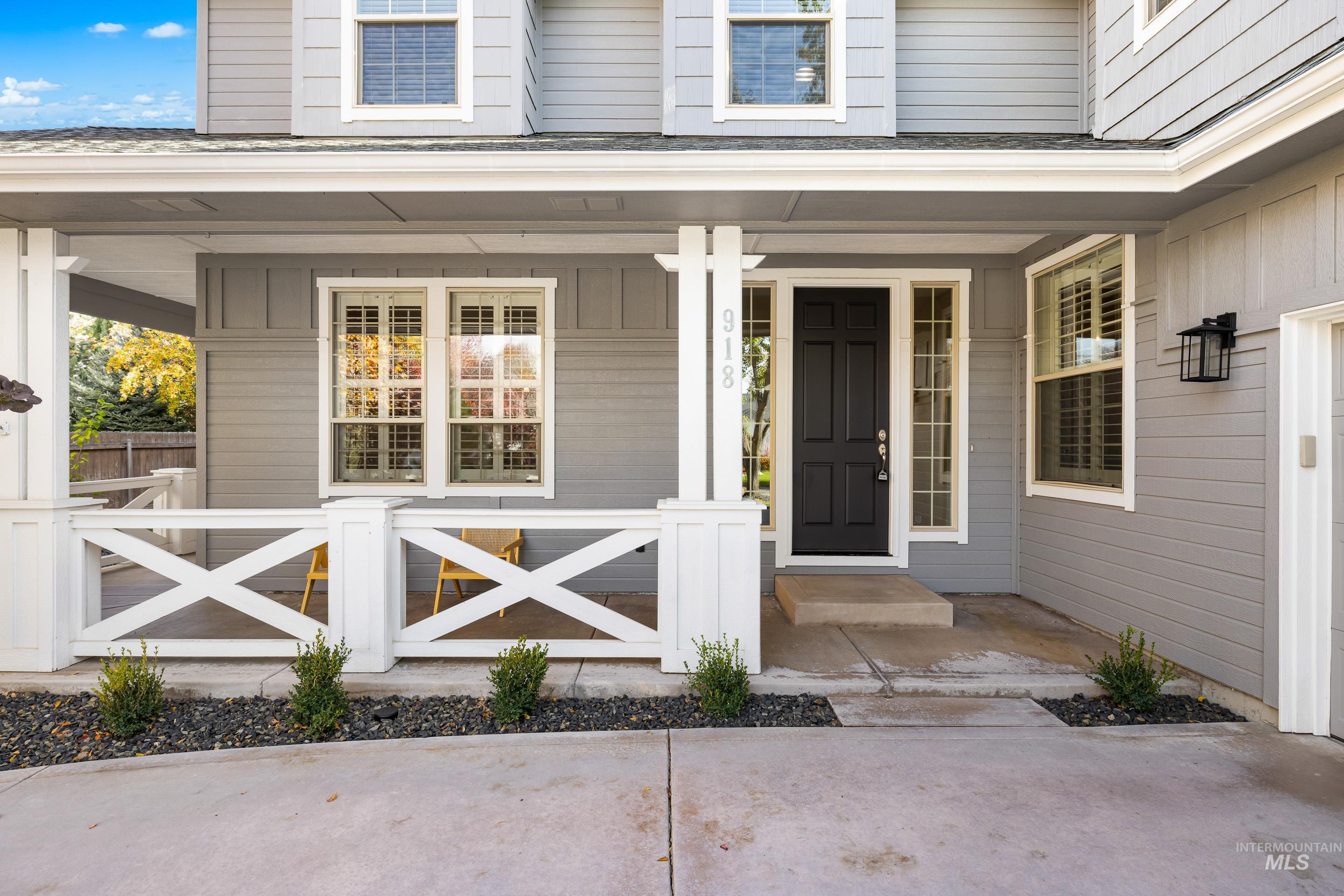 Entrance to property with a porch and board and batten siding