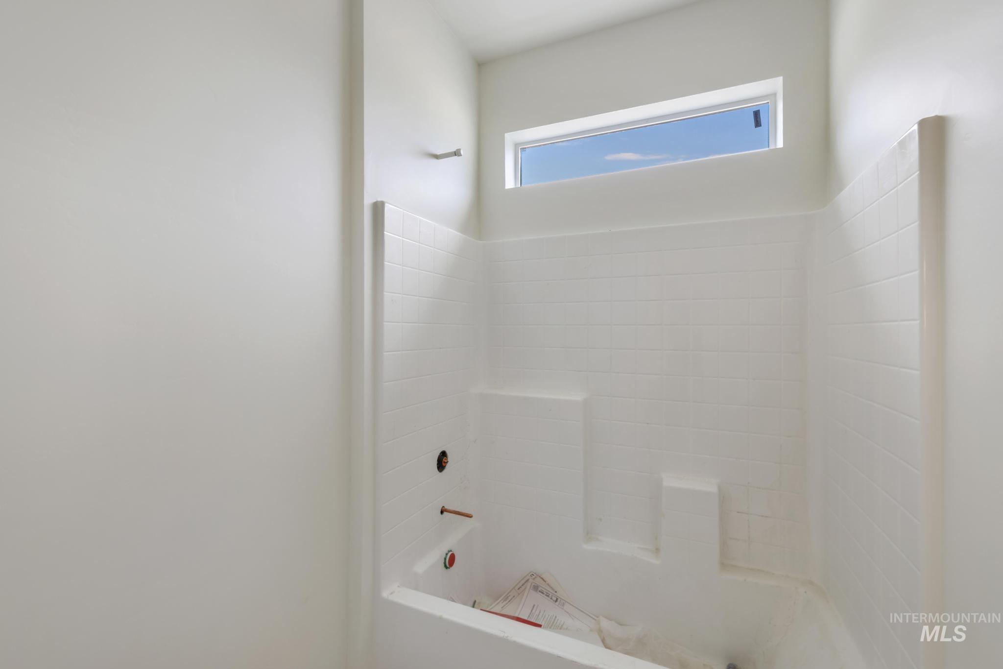 Full bathroom with shower / bathtub combination