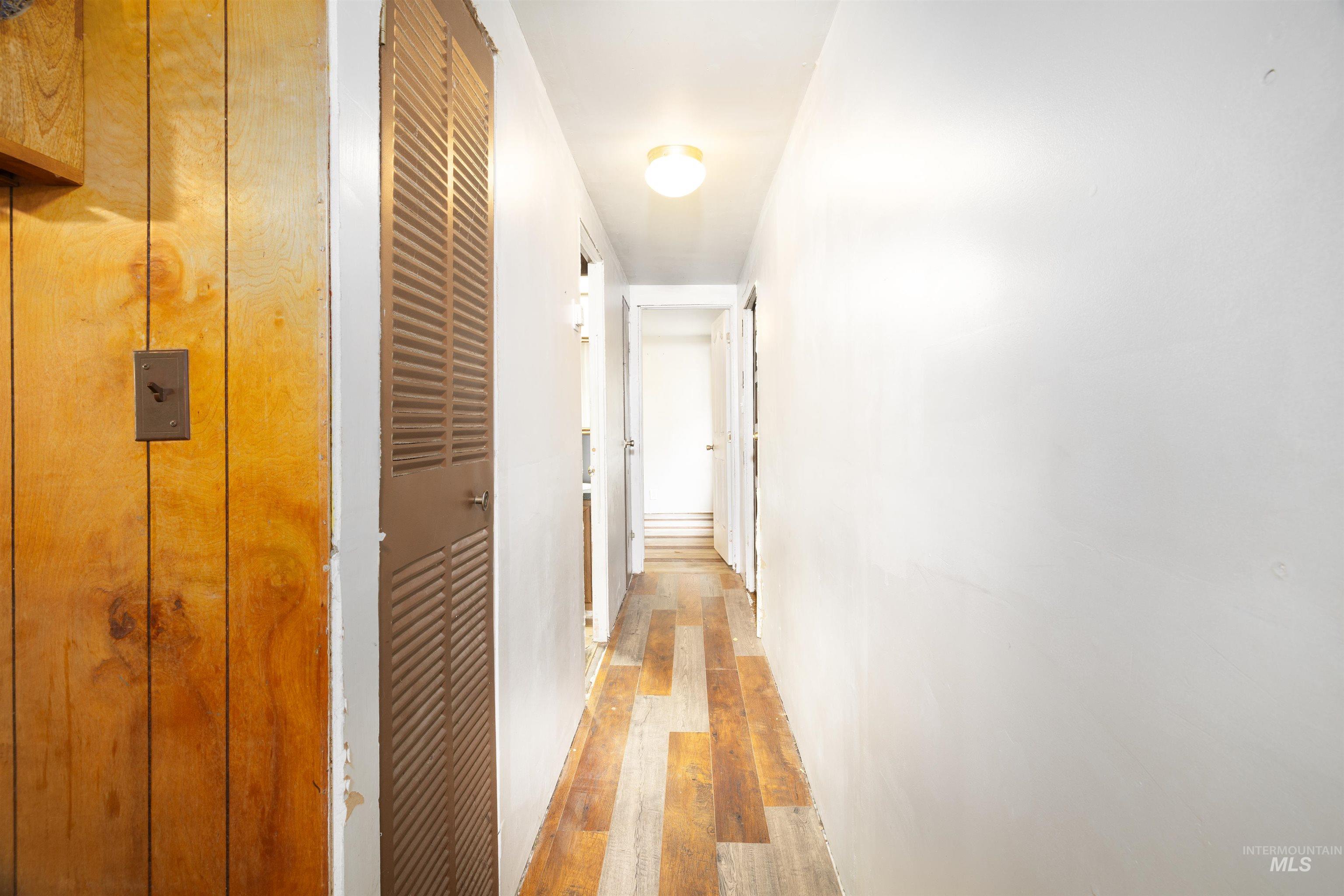 Hallway with light wood-type flooring
