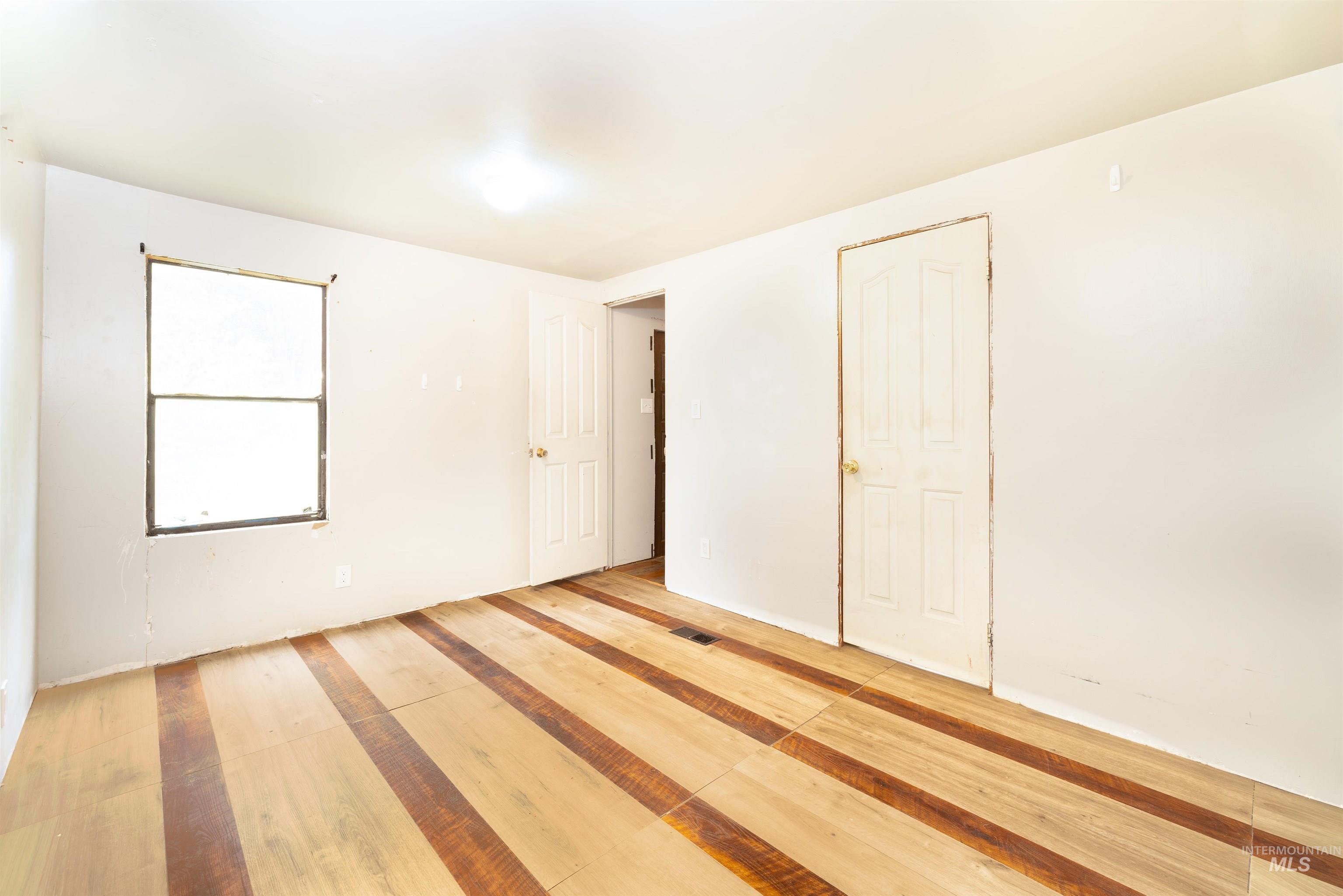 Unfurnished bedroom with baseboards