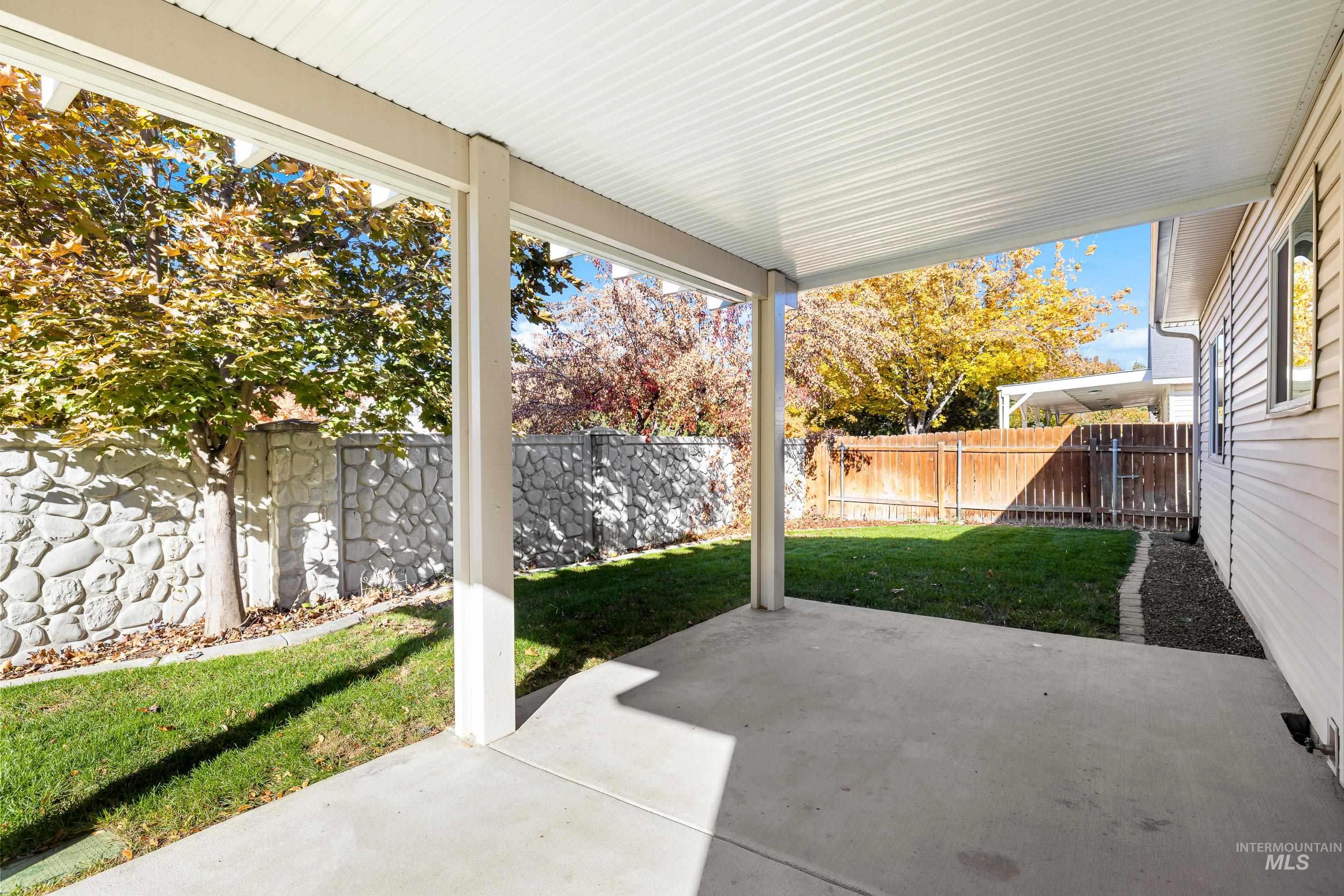 Fenced backyard featuring a patio area