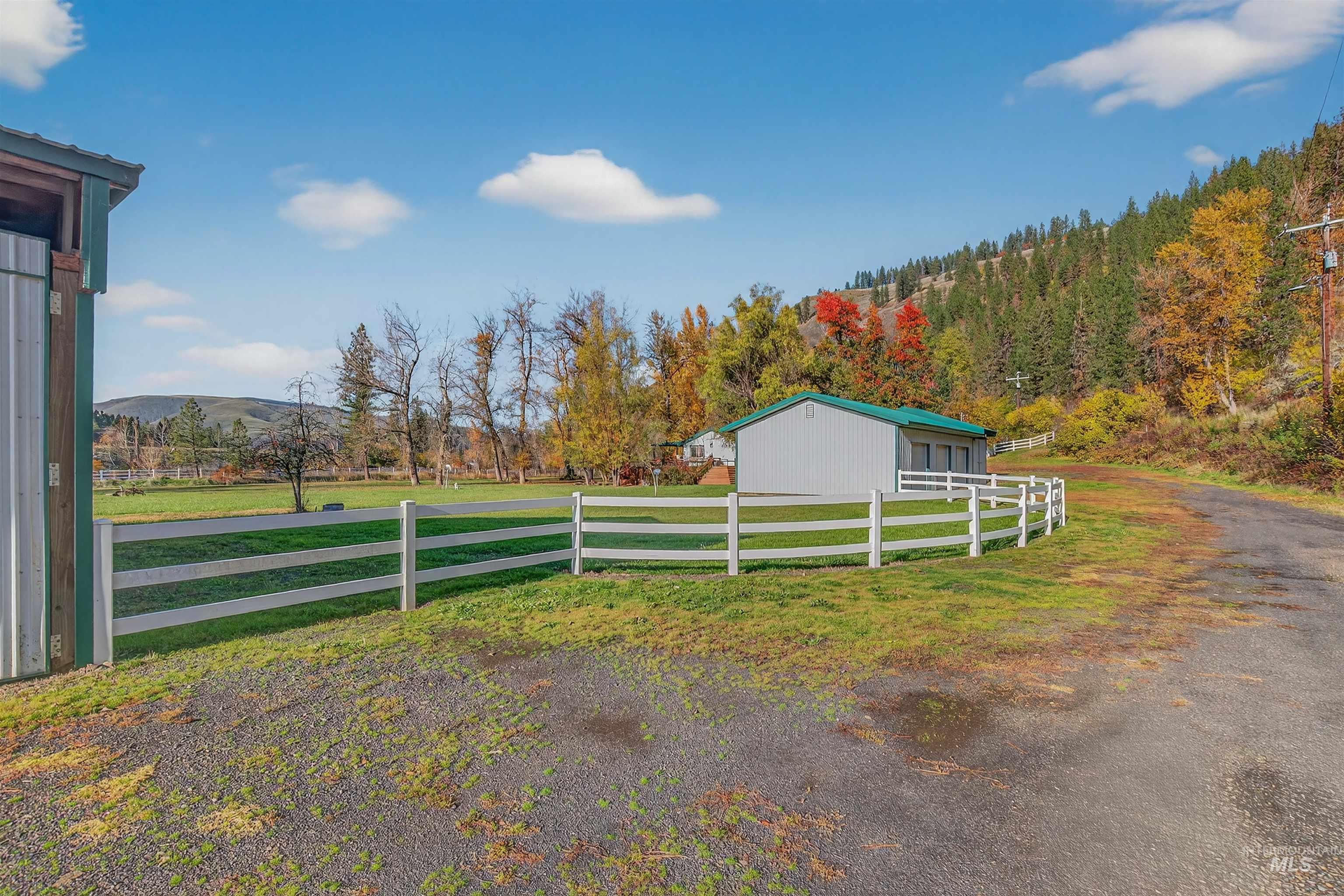 View of yard with an outbuilding, a mountain view, and a rural view