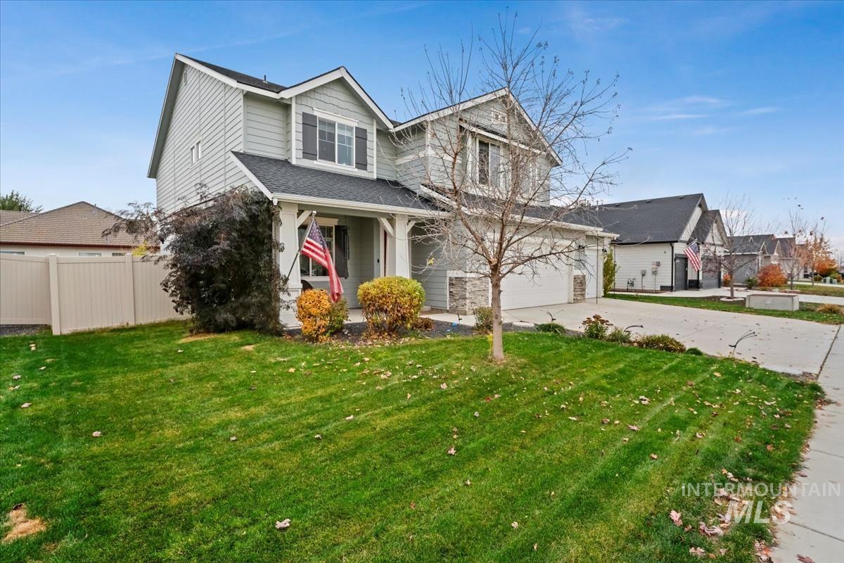 View of front of house with concrete driveway and a porch