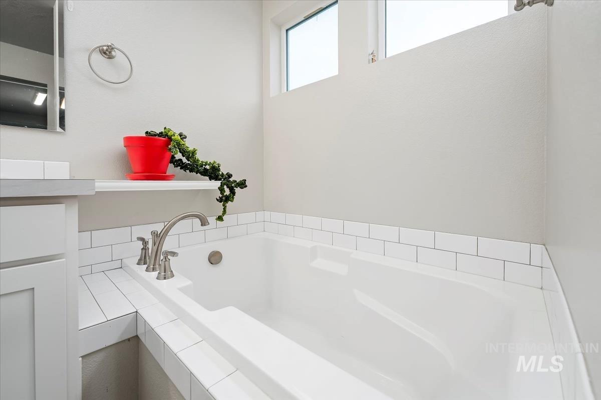 Bathroom with a garden tub and vanity