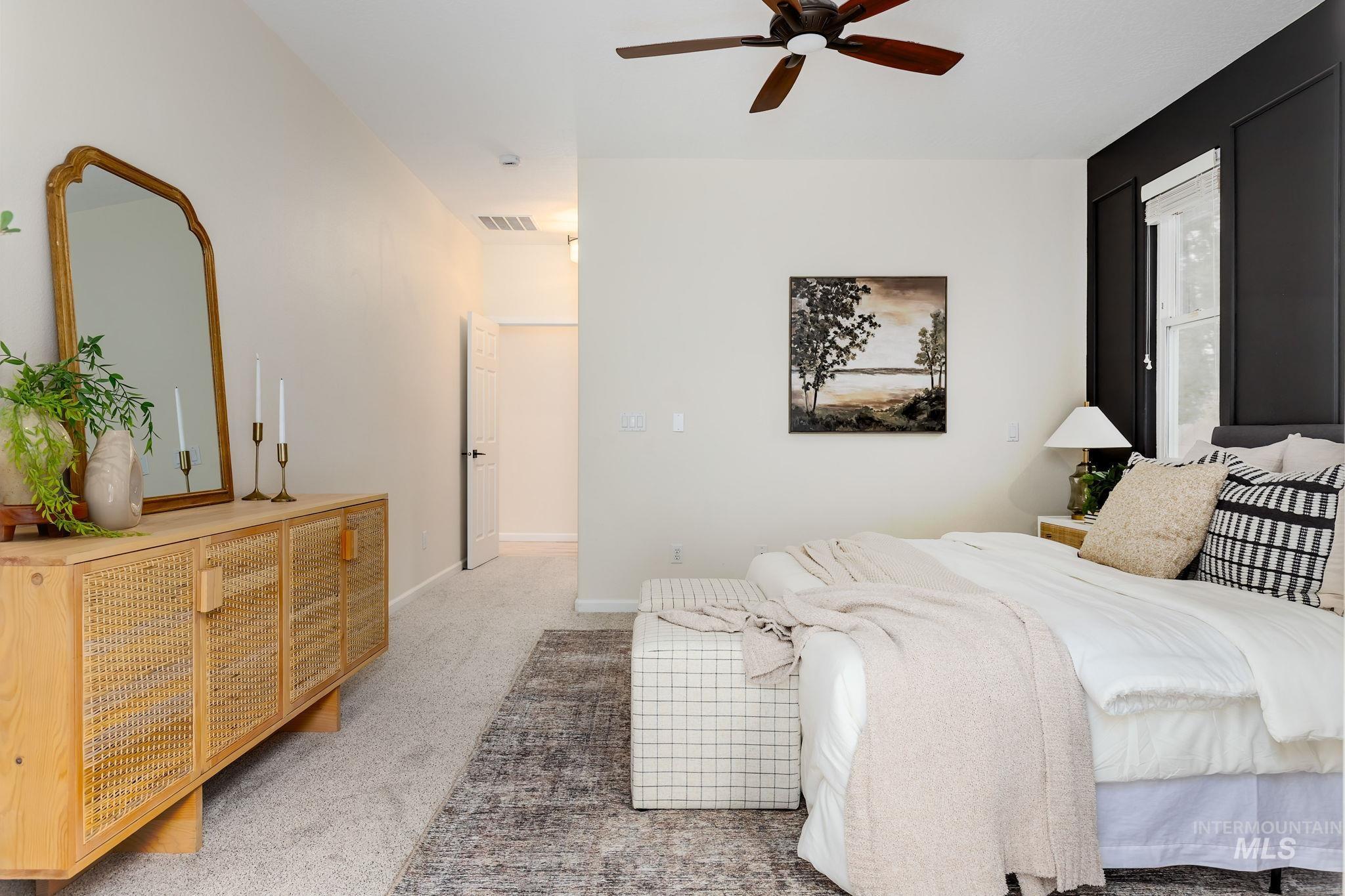 Bedroom with carpet and ceiling fan