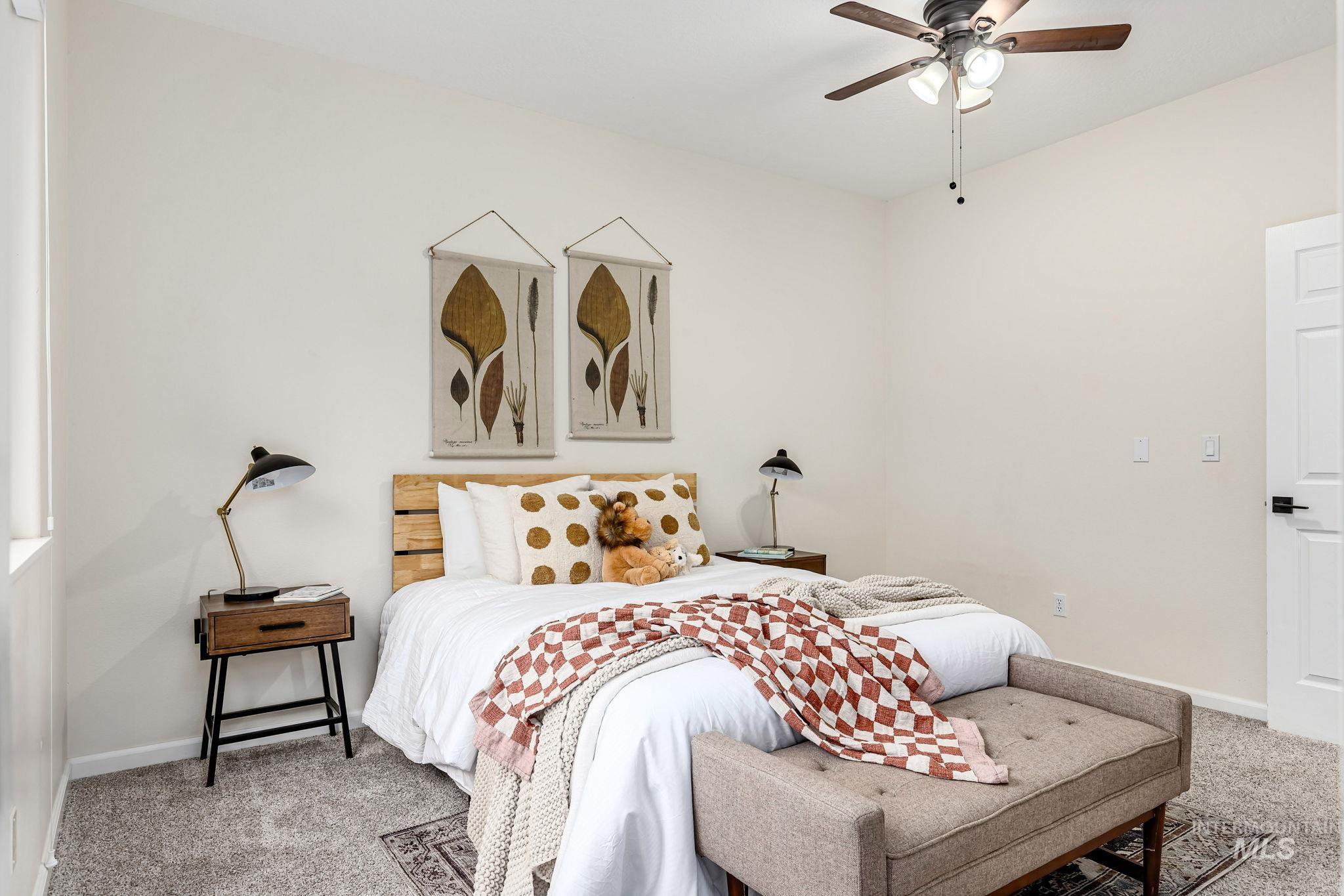 Bedroom with carpet and ceiling fan