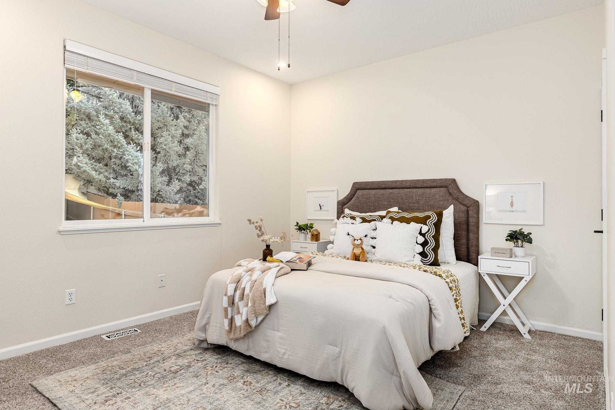 Bedroom featuring carpet and a ceiling fan