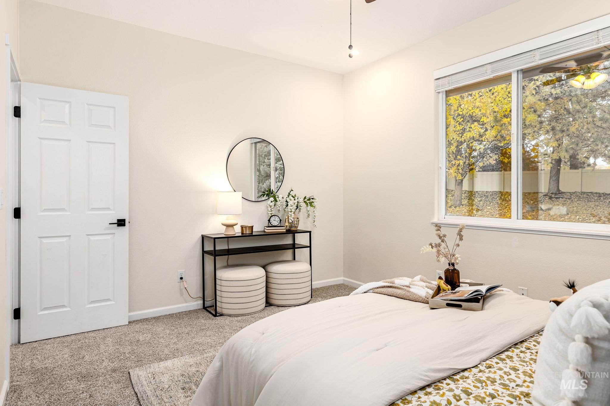 Carpeted bedroom with baseboards