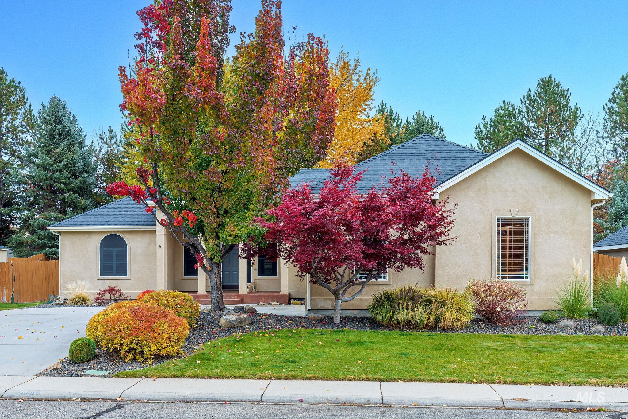 View of front of property featuring stucco siding and a shingled roof