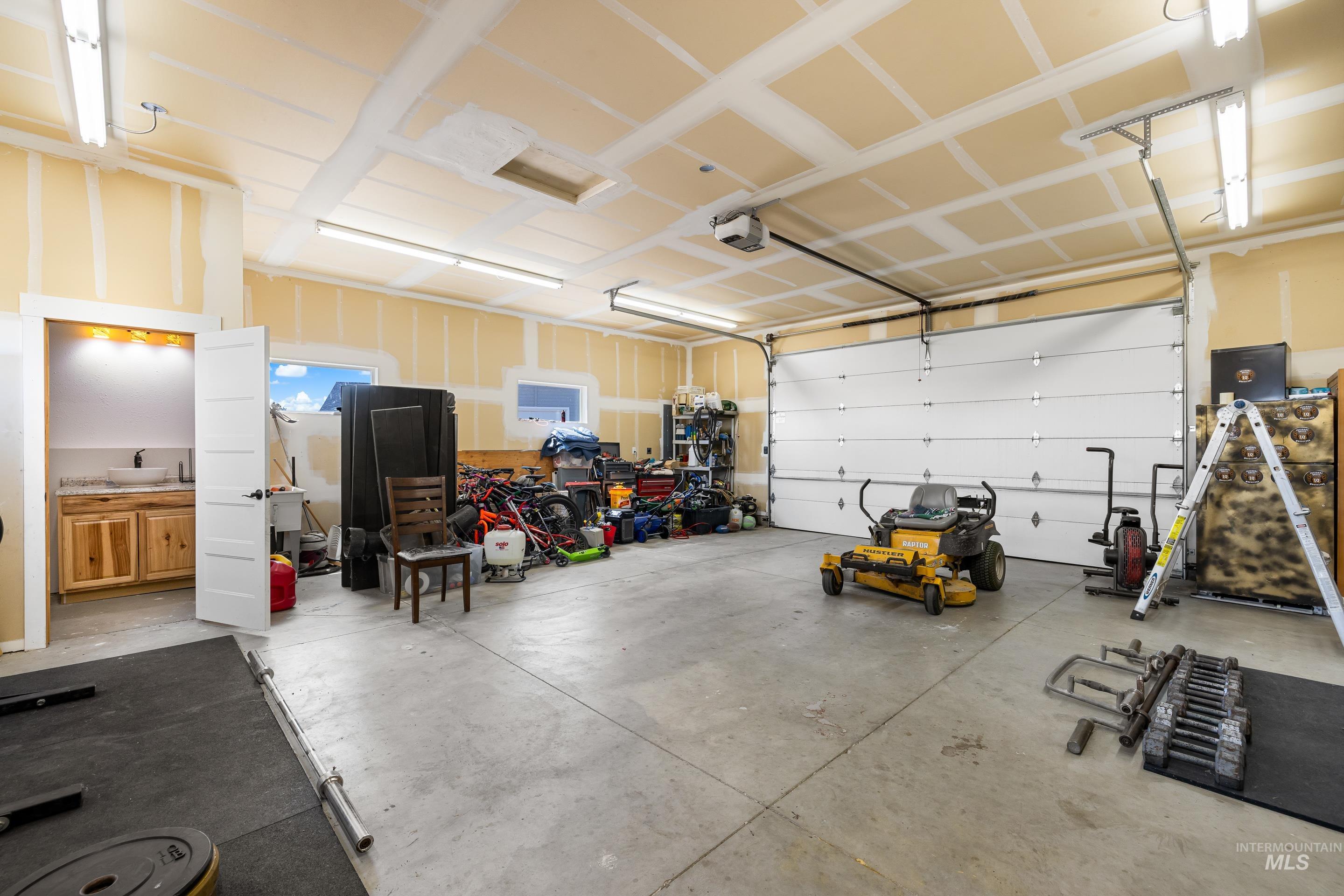 Garage featuring a garage door opener