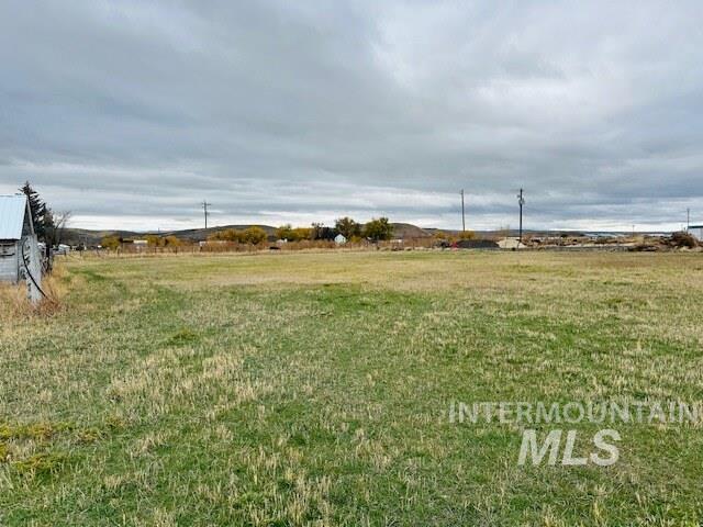 View of green lawn featuring a view of countryside