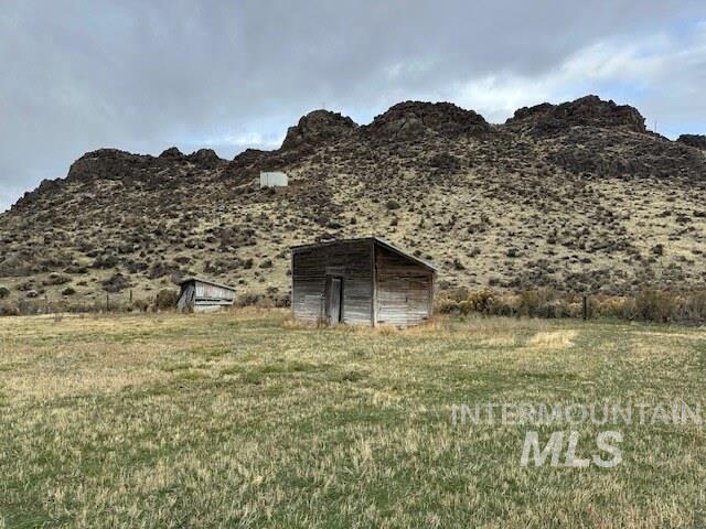 View of mountain background featuring rural landscape