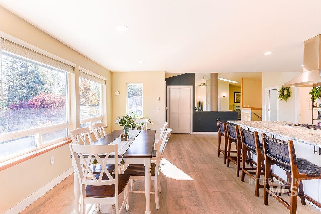 Dining room featuring light wood-style floors and recessed lighting