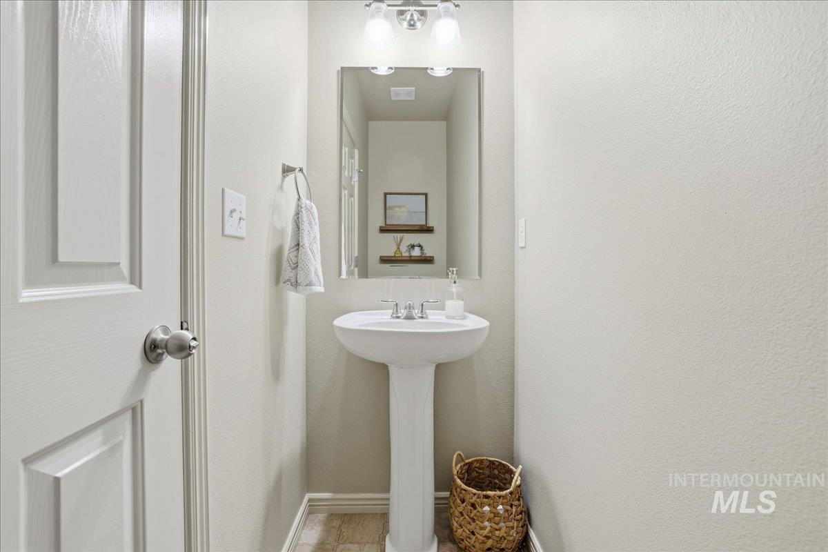 Bathroom featuring a textured wall