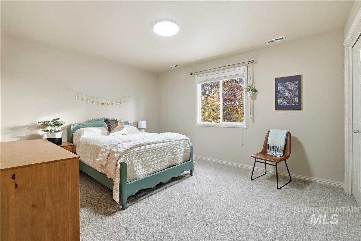 Carpeted bedroom with baseboards