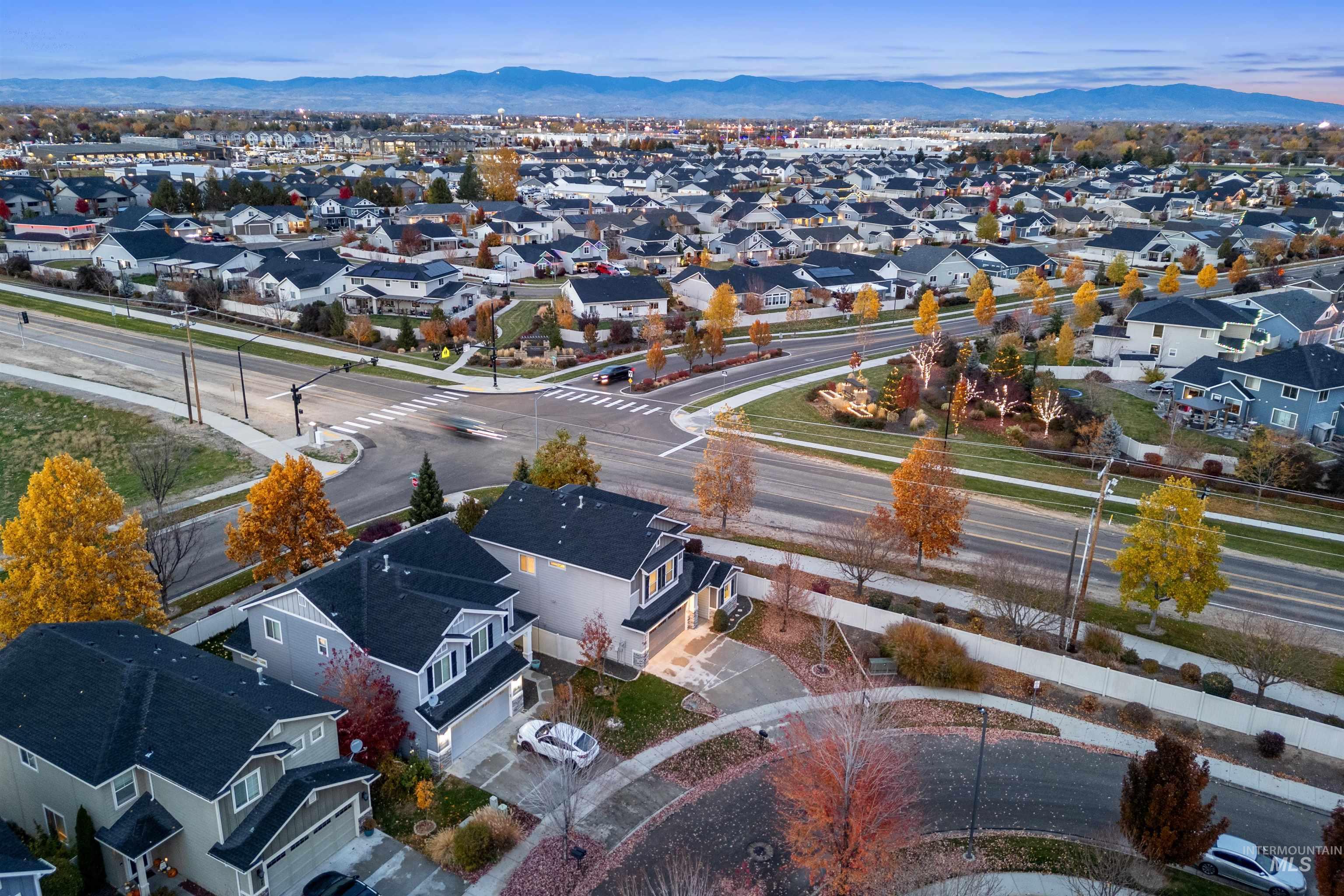 Aerial perspective of suburban area with a mountain backdrop