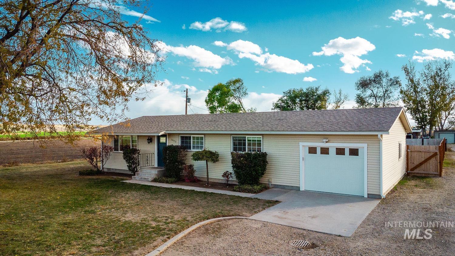 Single story home featuring a garage