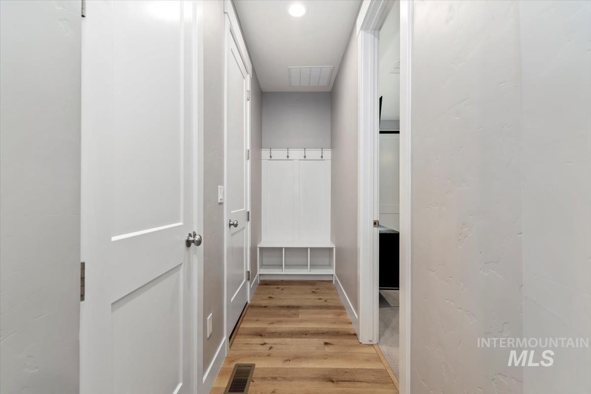 Corridor with light wood finished floors