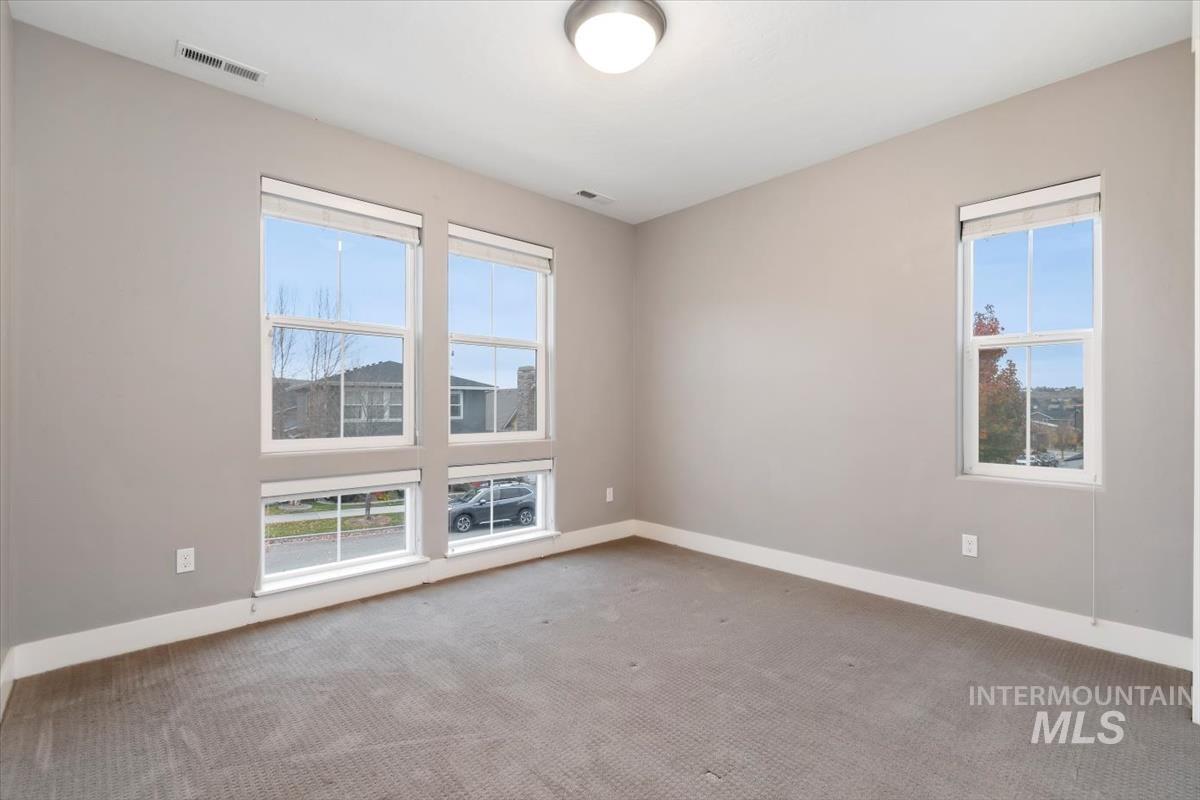 Empty room with carpet floors