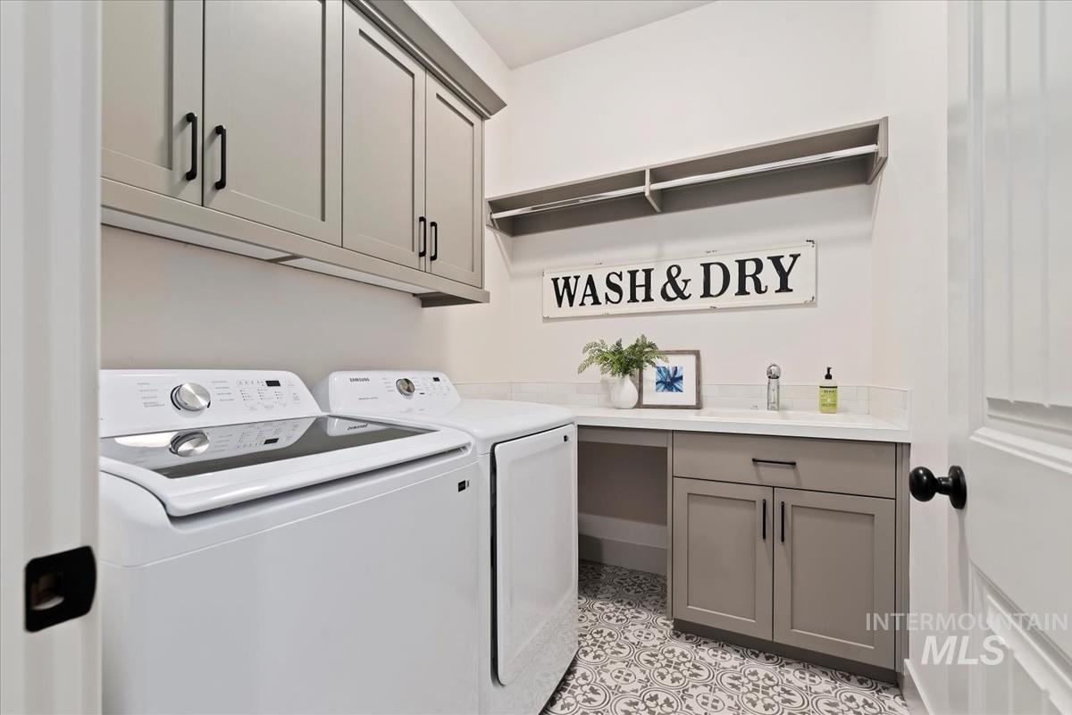 Laundry room with cabinet space and separate washer and dryer