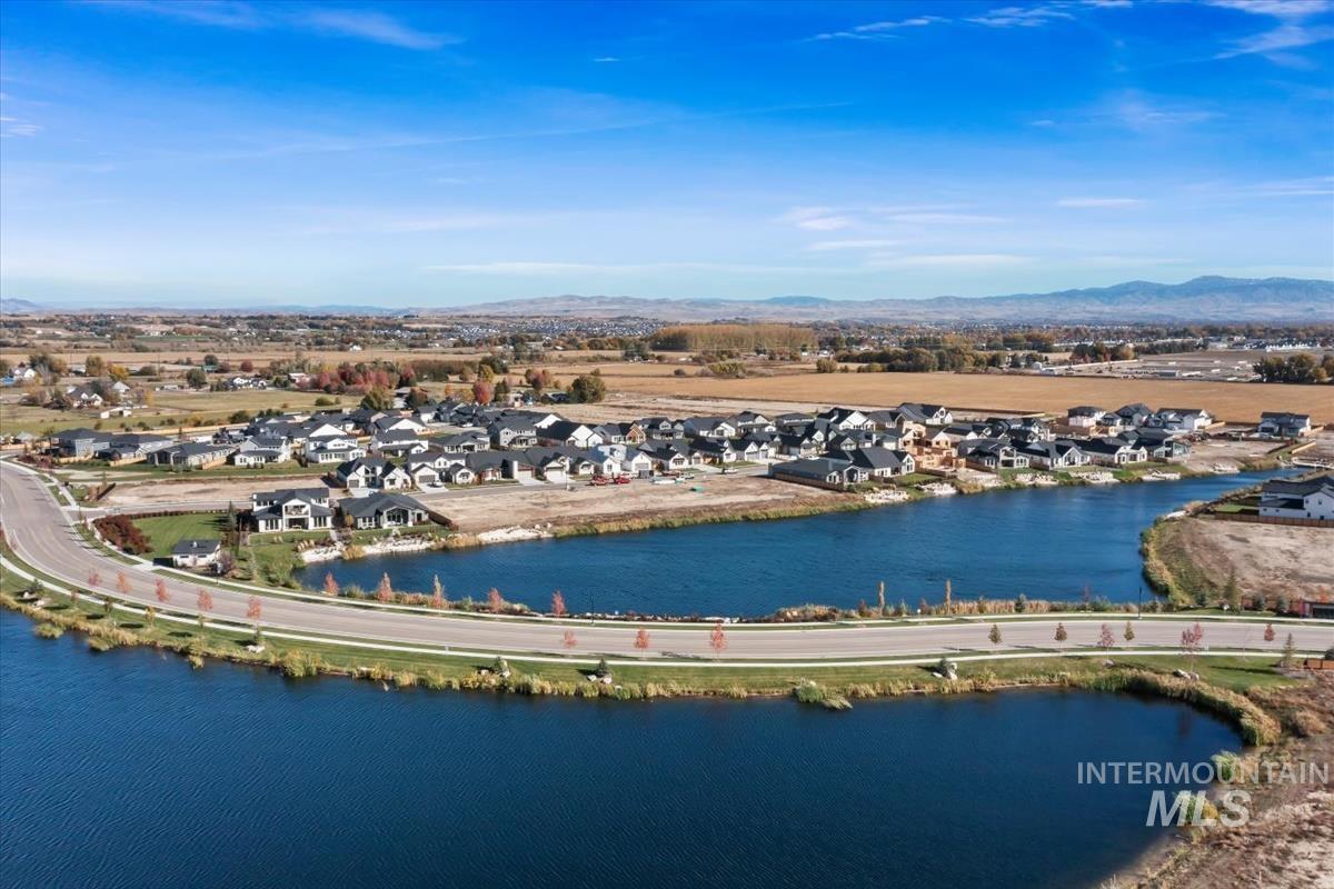 Aerial perspective of suburban area featuring a mountain backdrop