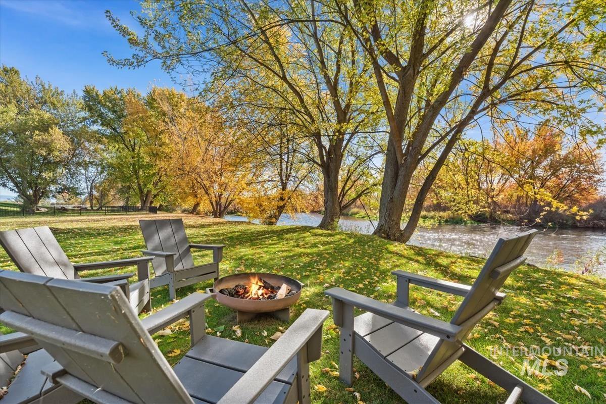 View of green lawn with a water view