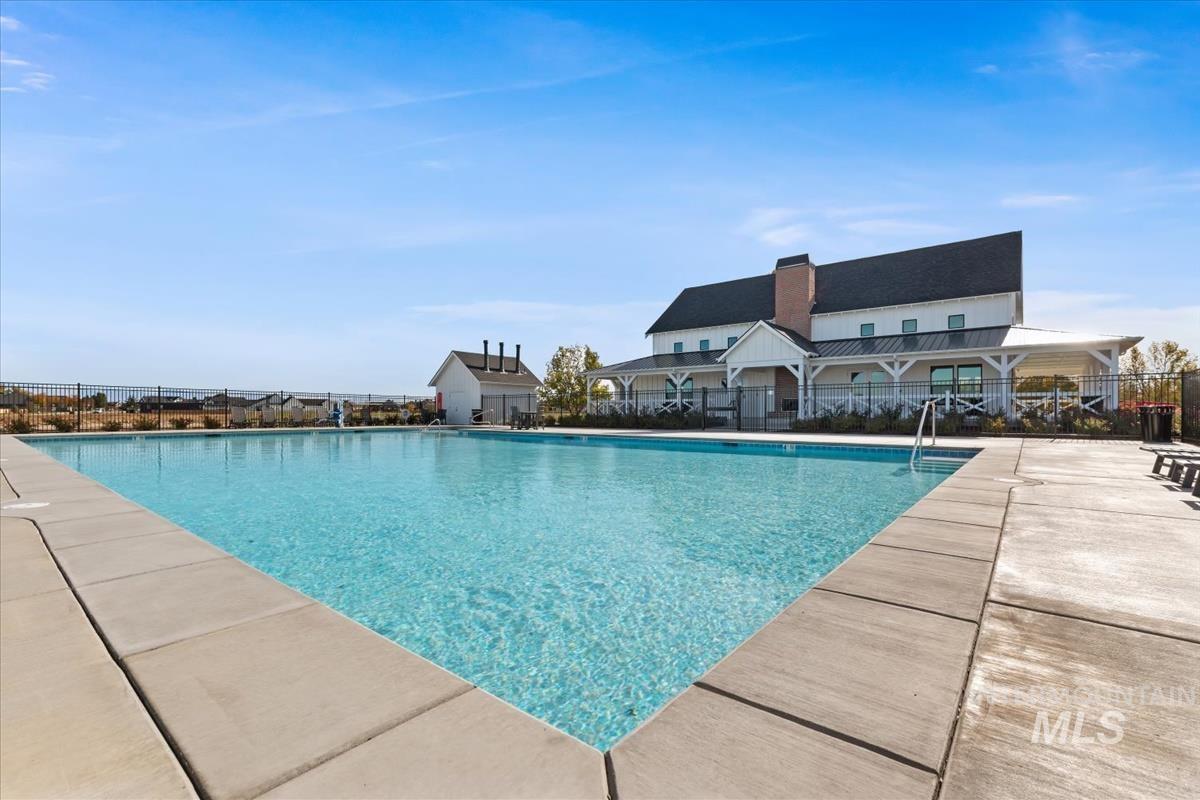 Community pool featuring a patio