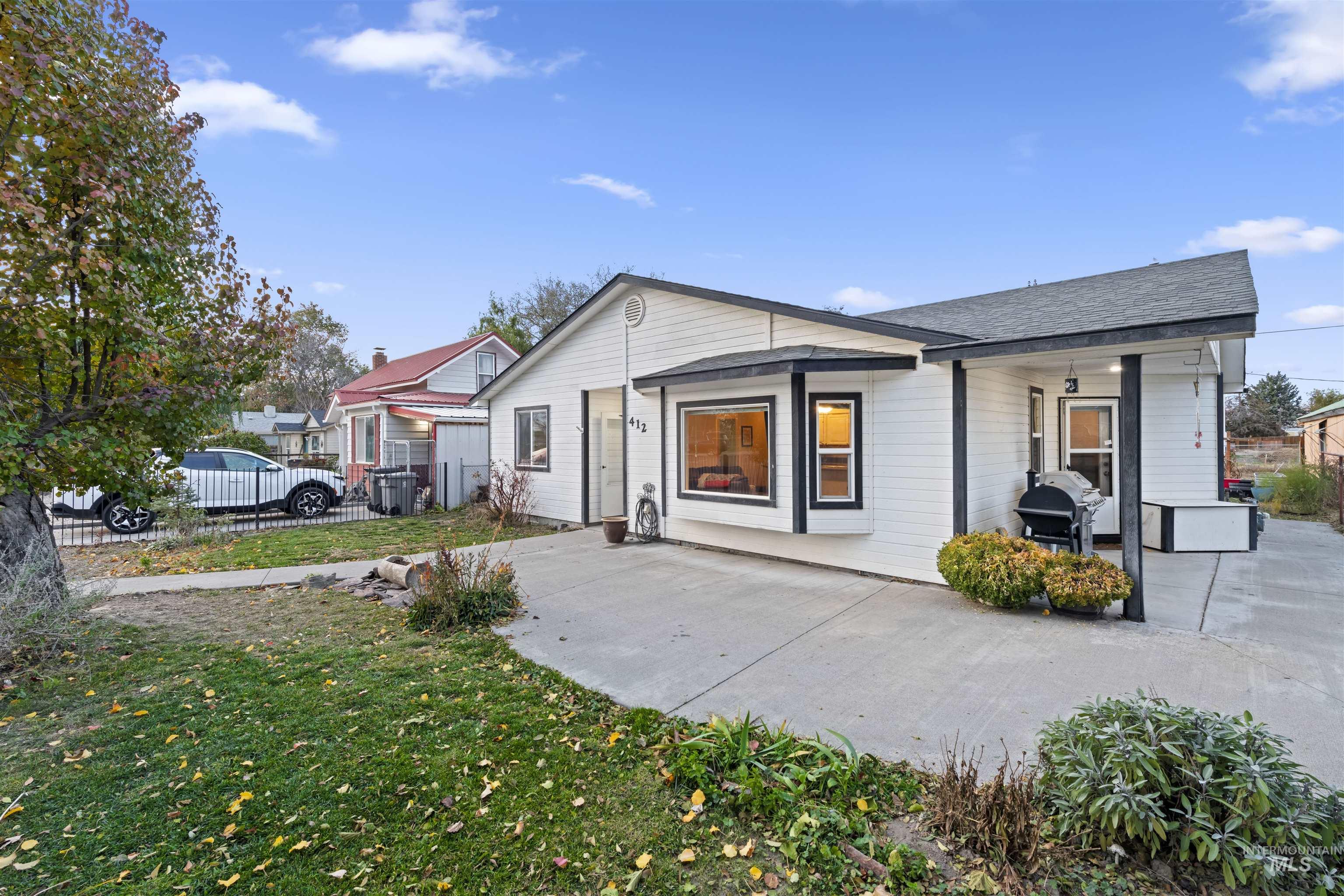 Rear view of house with a shingled roof