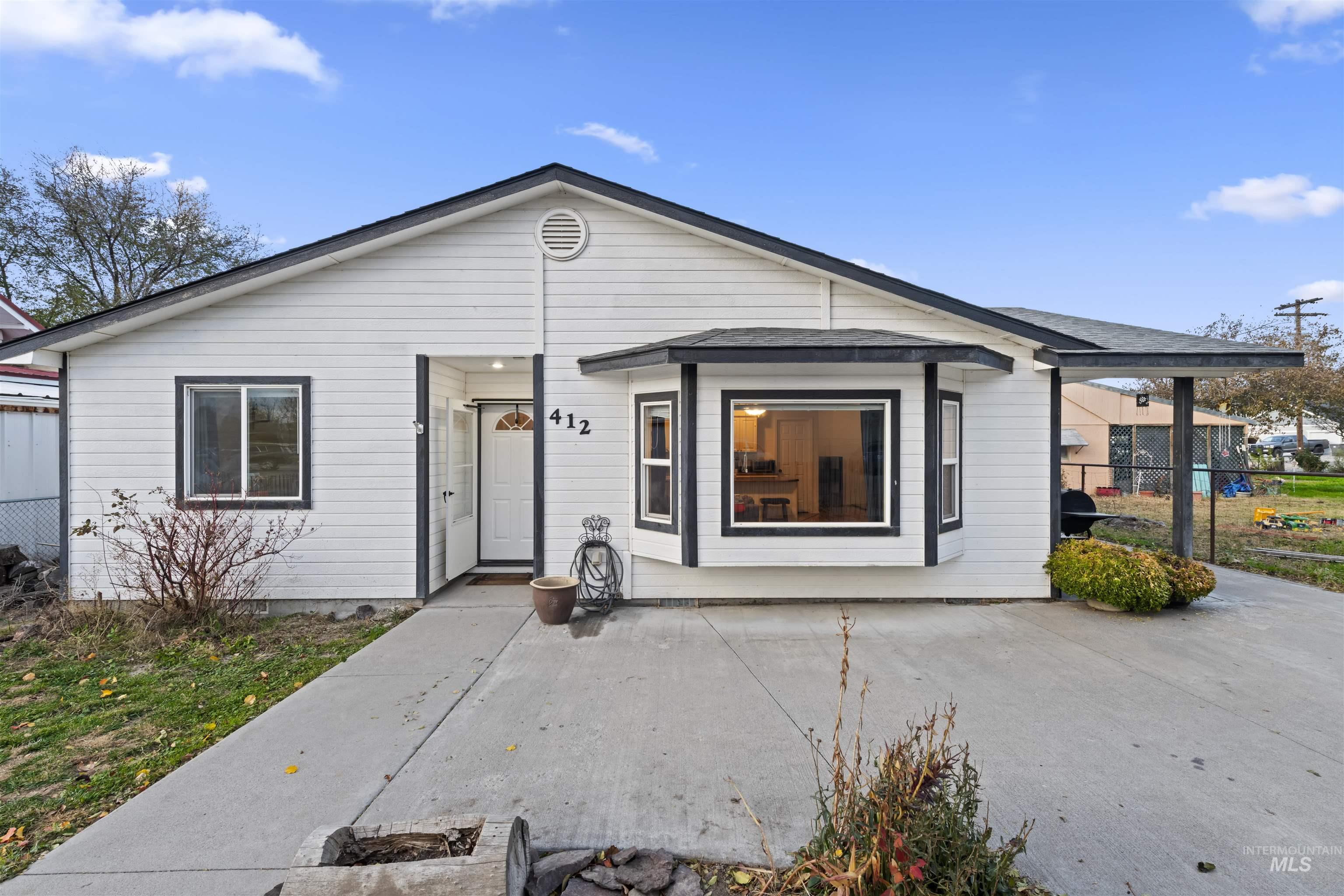 View of front of home featuring roof with shingles