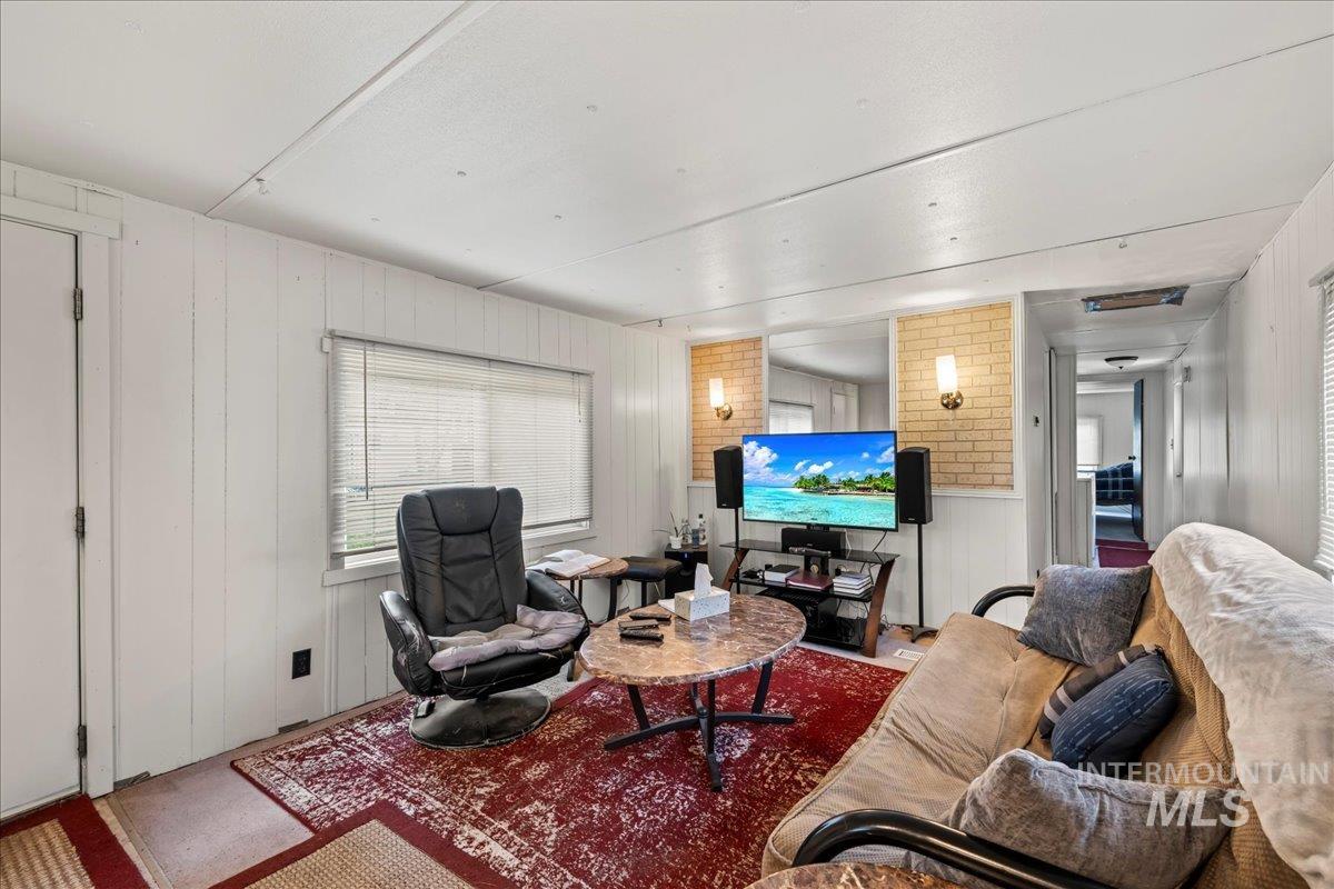 Living area with wood walls
