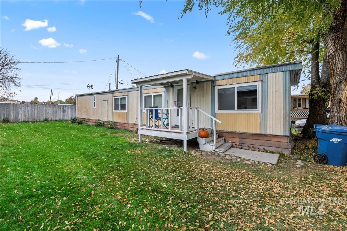 Rear view of house featuring a wooden deck