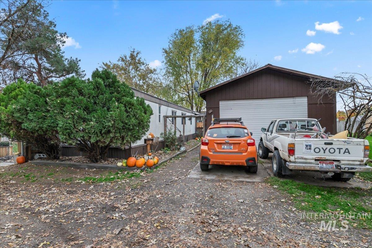 View of side of home with a garage