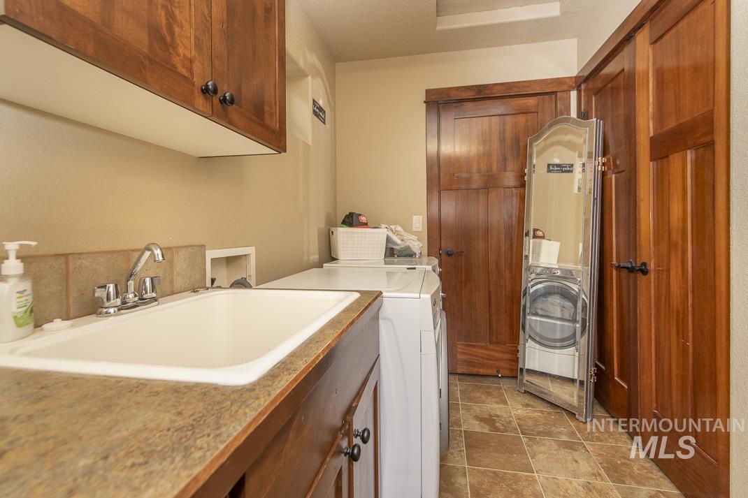 Laundry area featuring cabinet space and washer and dryer