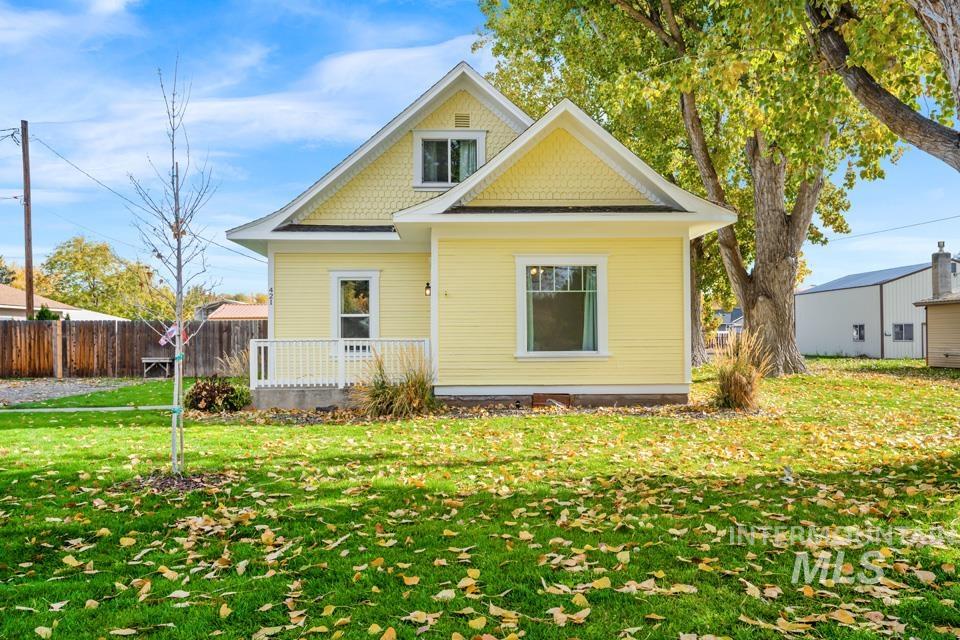 Rear view of house featuring a wooden deck