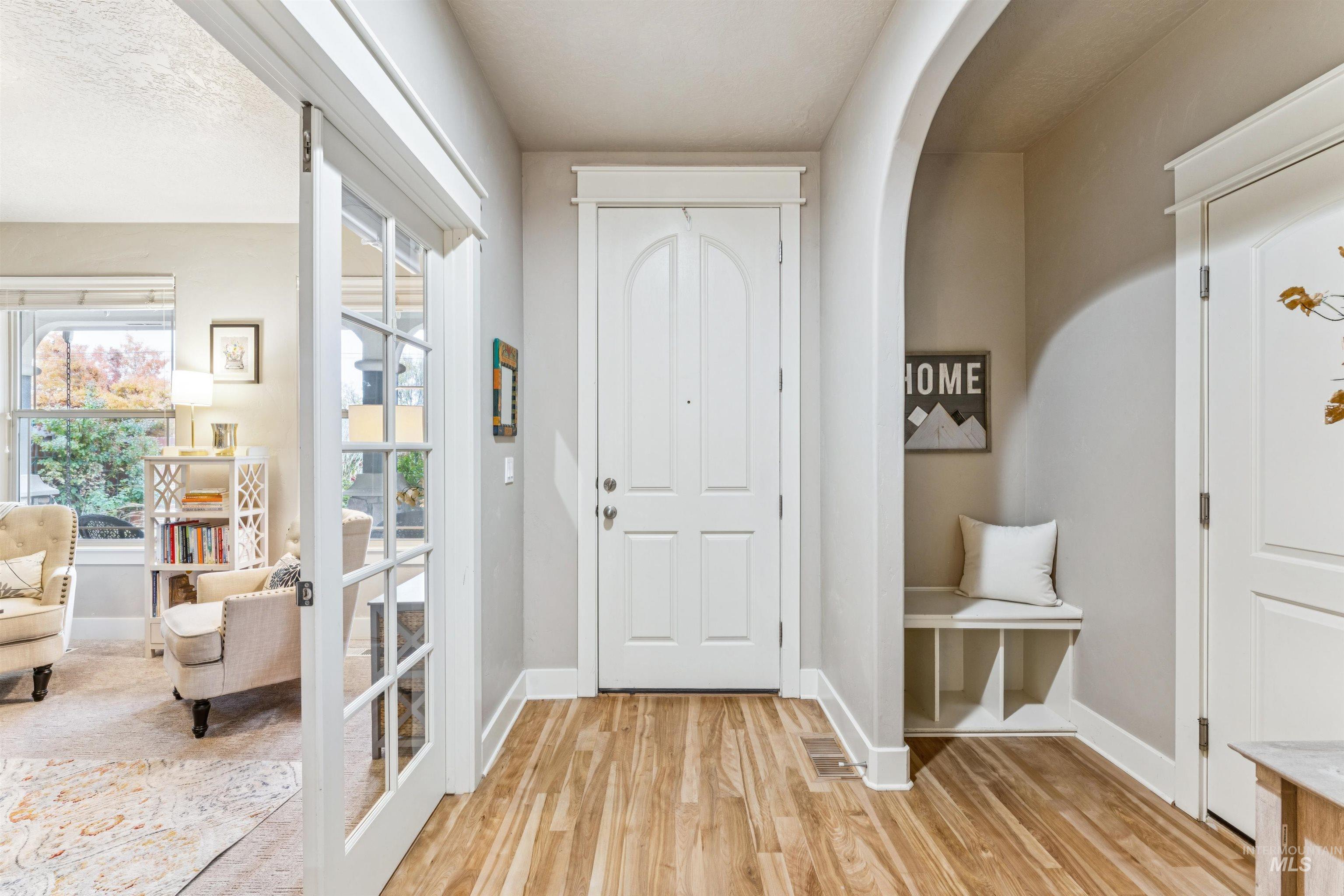 Foyer entrance featuring baseboards and light wood-style floors