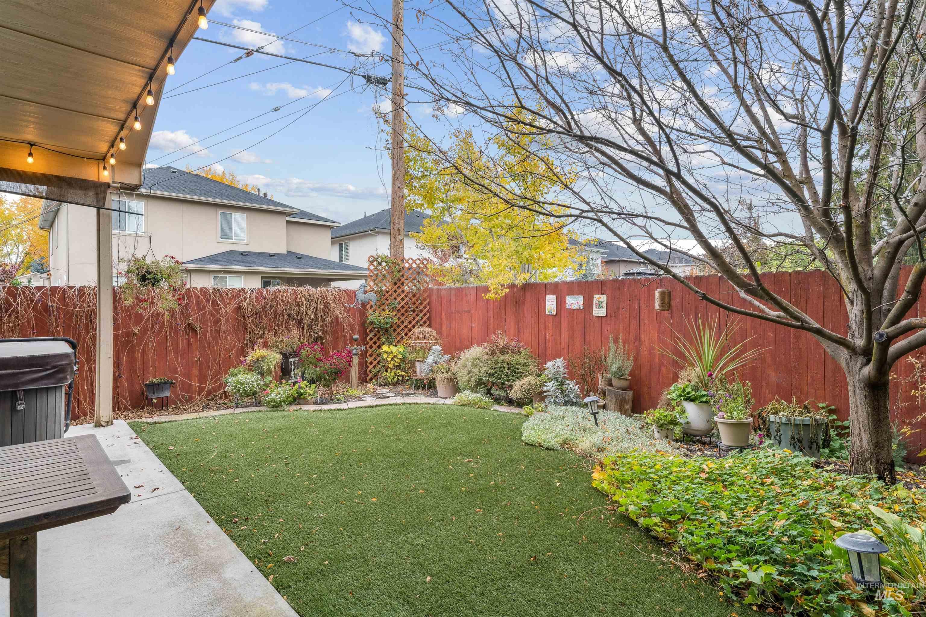 Fenced backyard with a patio area