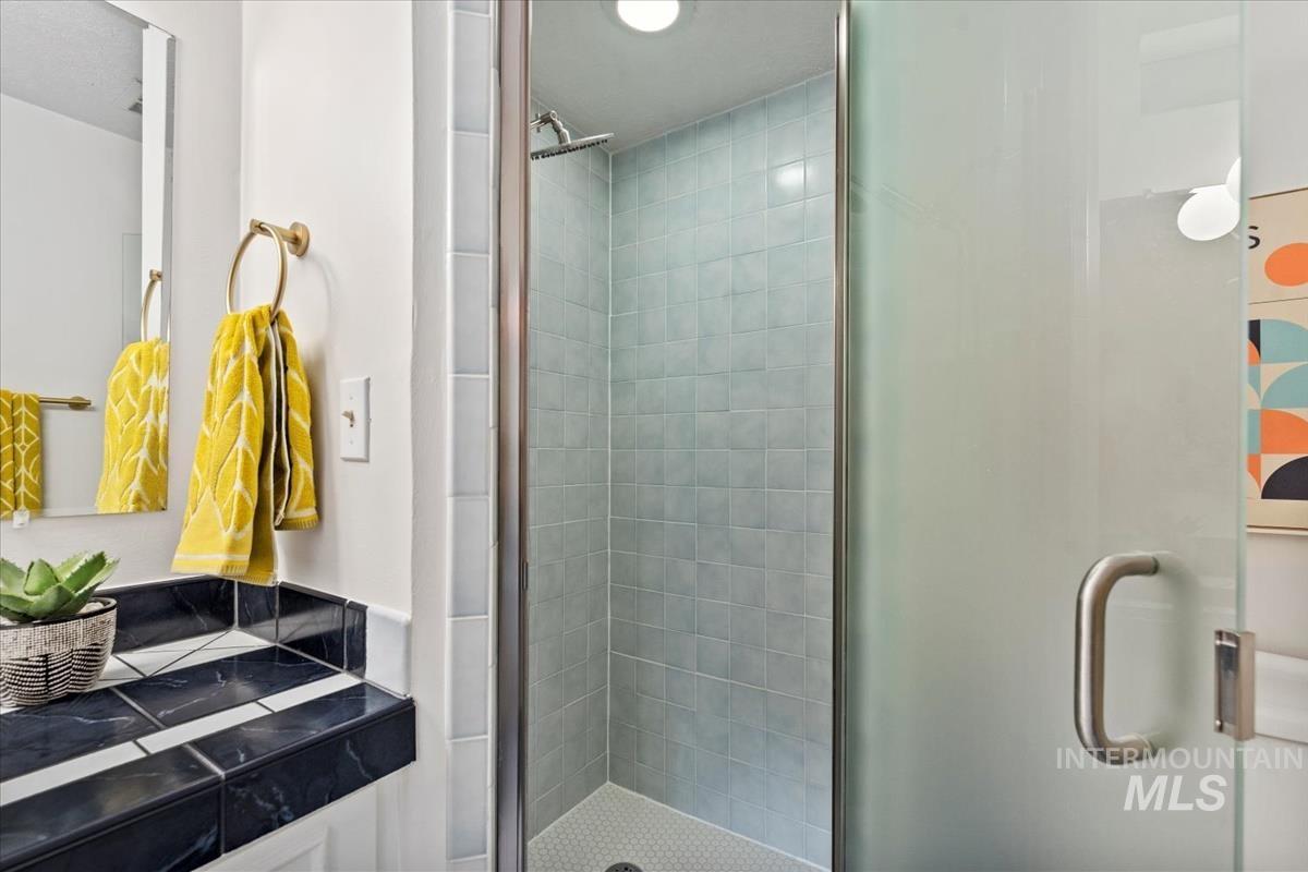 Bathroom featuring a shower stall