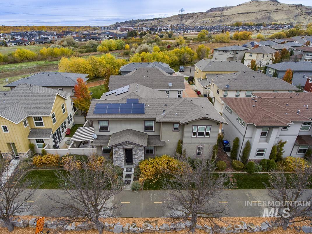 Aerial view of residential area with a mountain backdrop