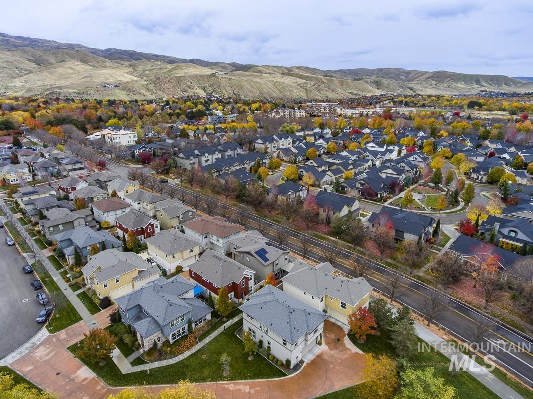 Aerial perspective of suburban area featuring a mountainous background