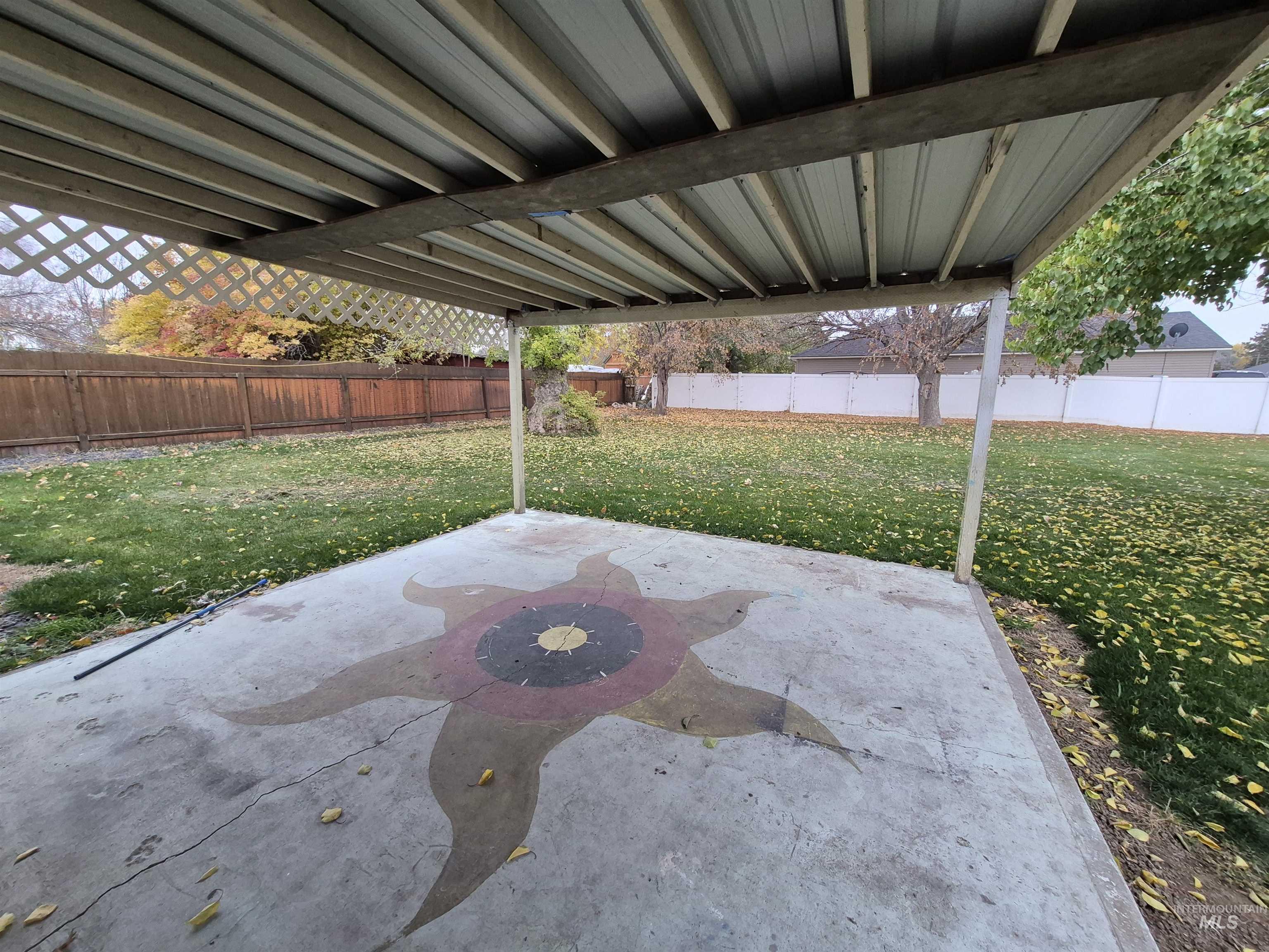 Fenced backyard featuring a patio