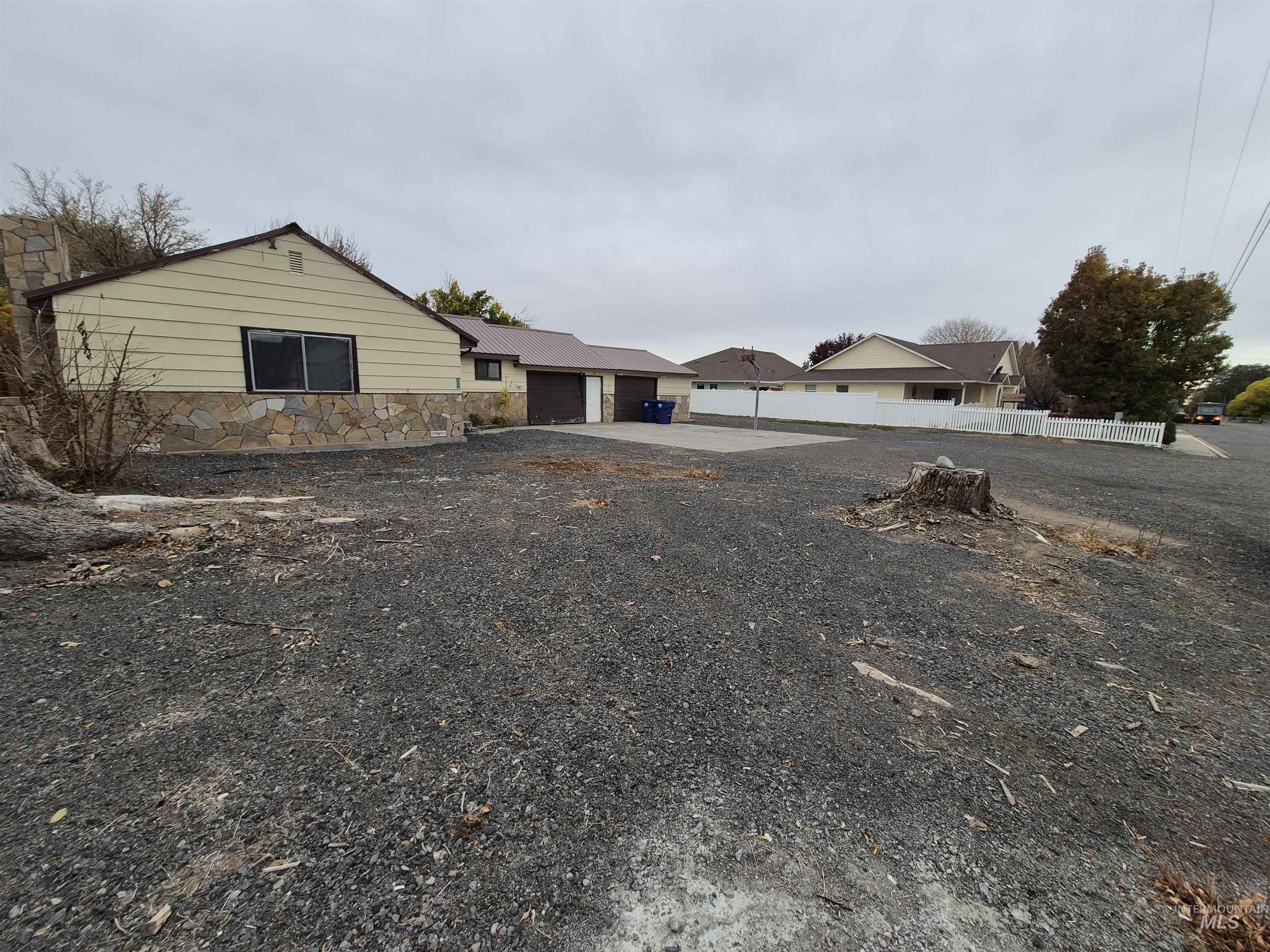 View of front of home with a garage and a residential view