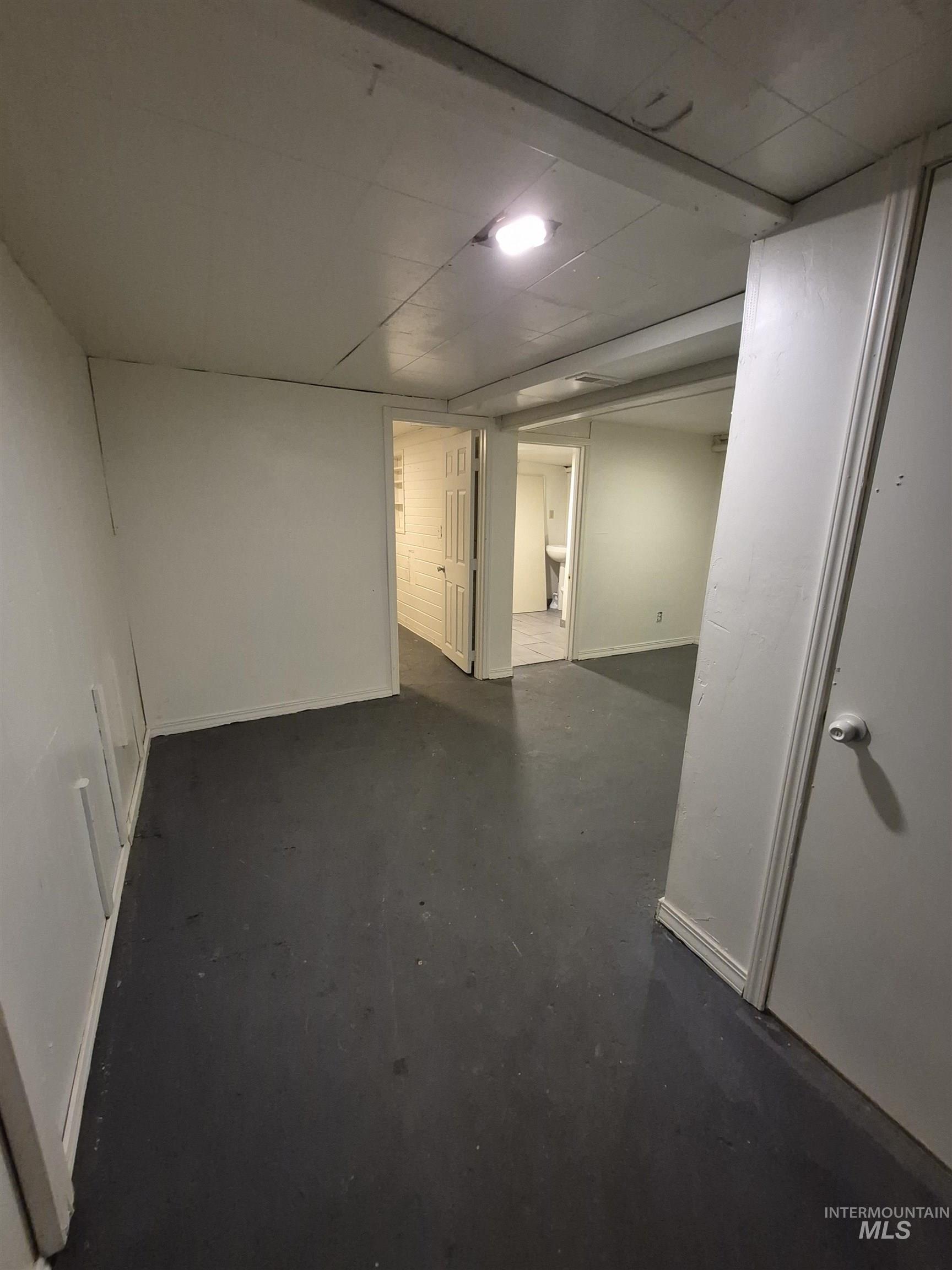 Empty room featuring baseboards