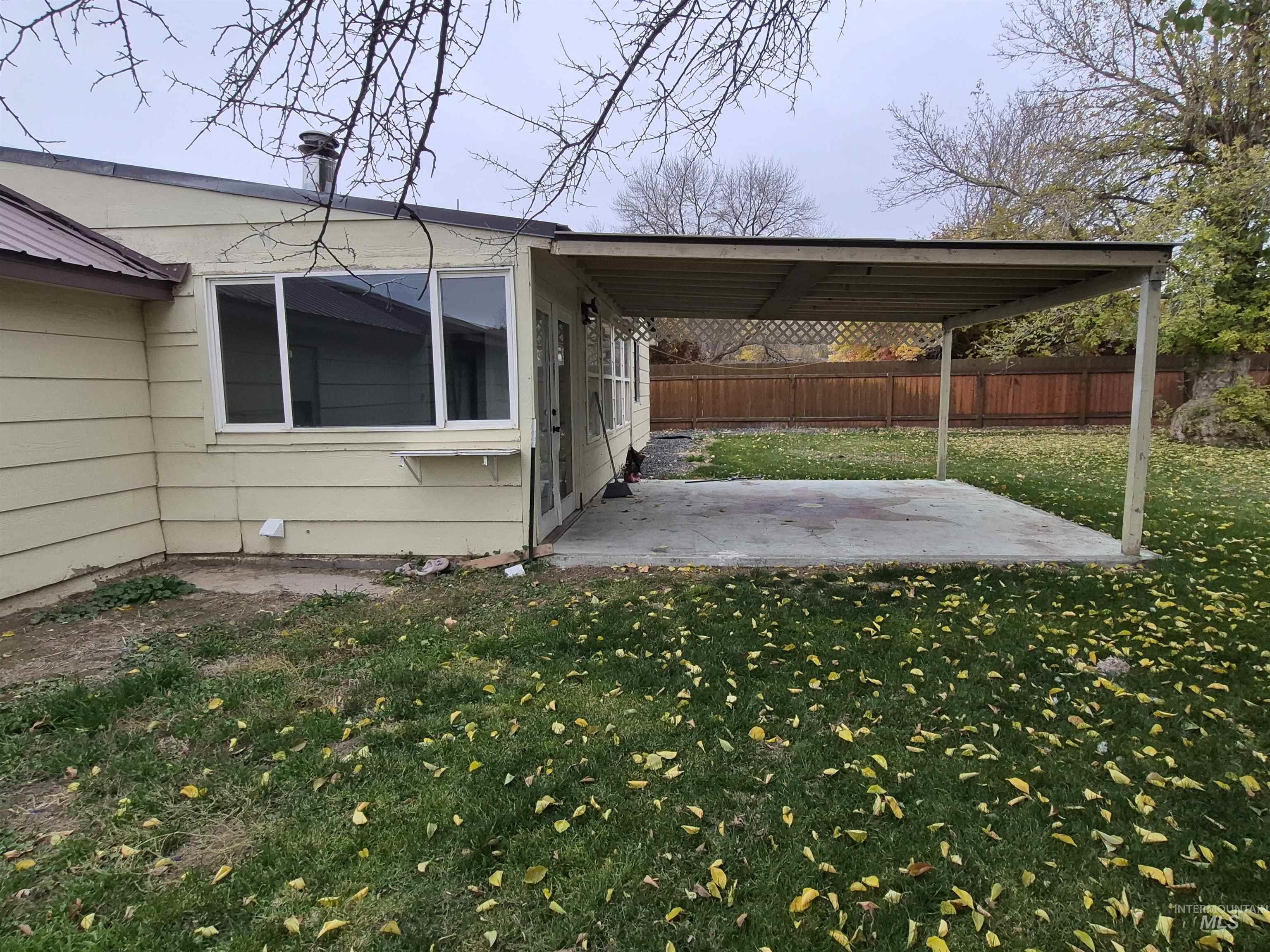 View of car parking featuring a fenced backyard