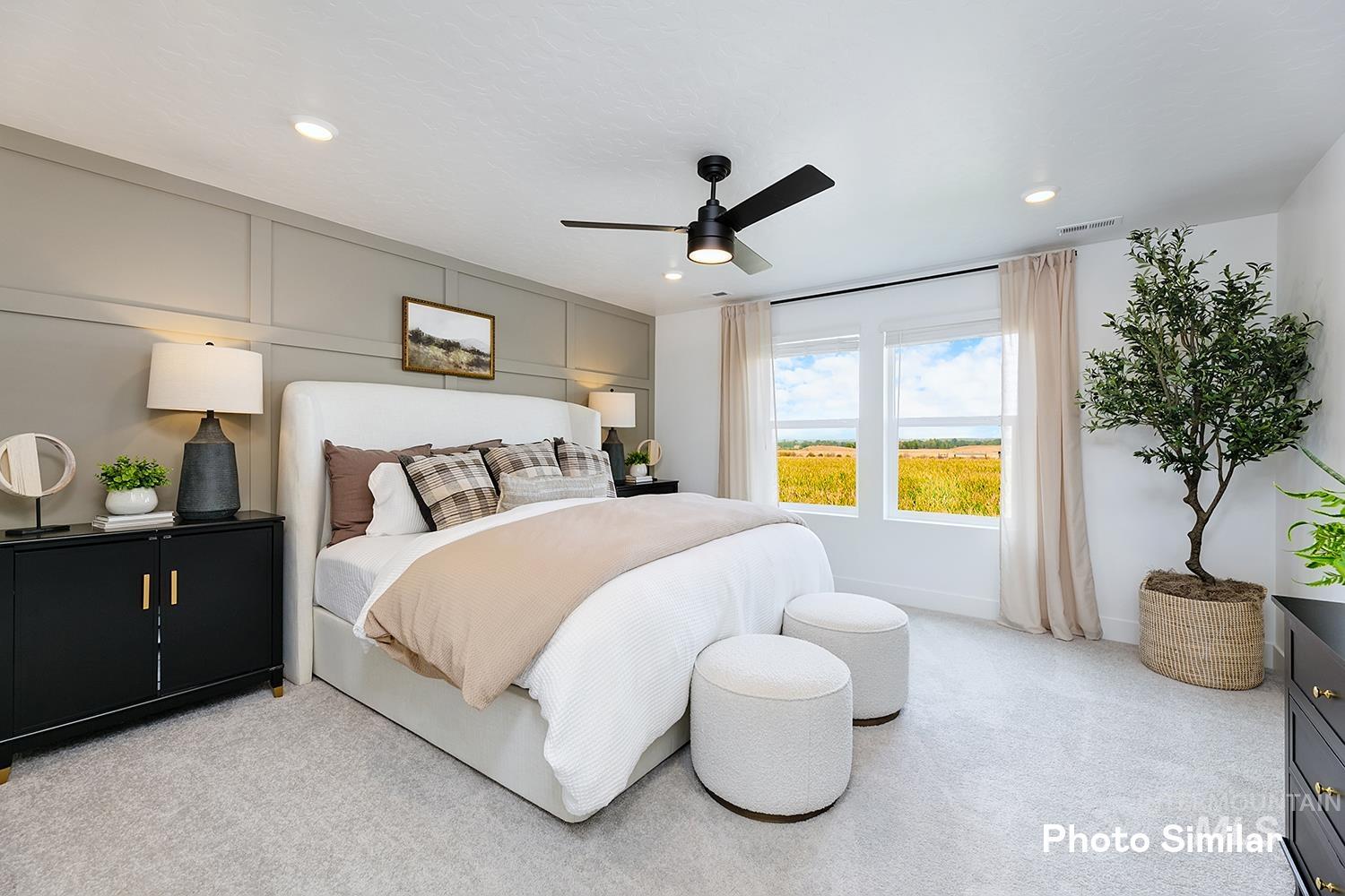 Bedroom featuring light colored carpet, a ceiling fan, and recessed lighting