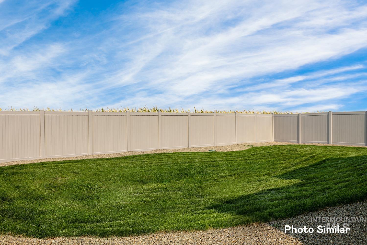 View of fenced backyard