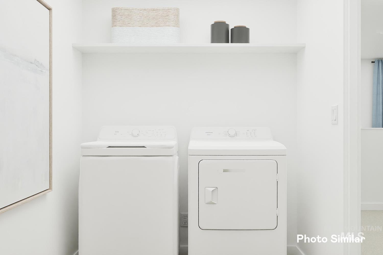 Laundry room featuring washer and clothes dryer