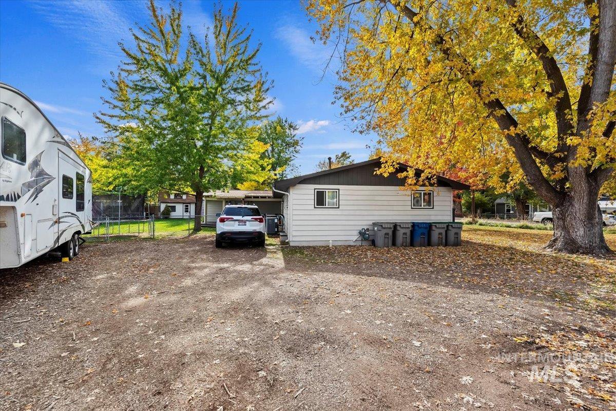 View of side of property featuring a trampoline