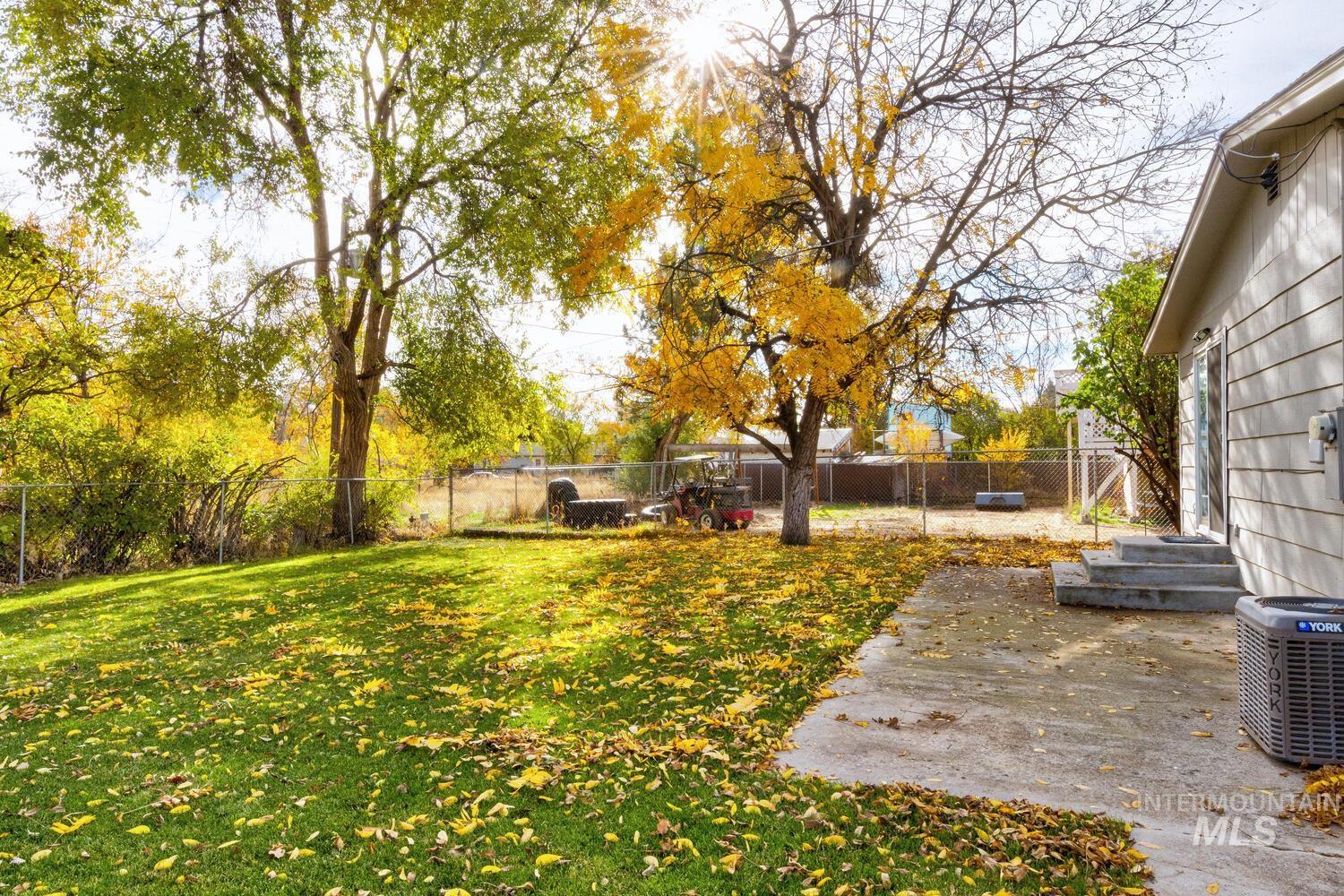 Fenced backyard featuring a patio