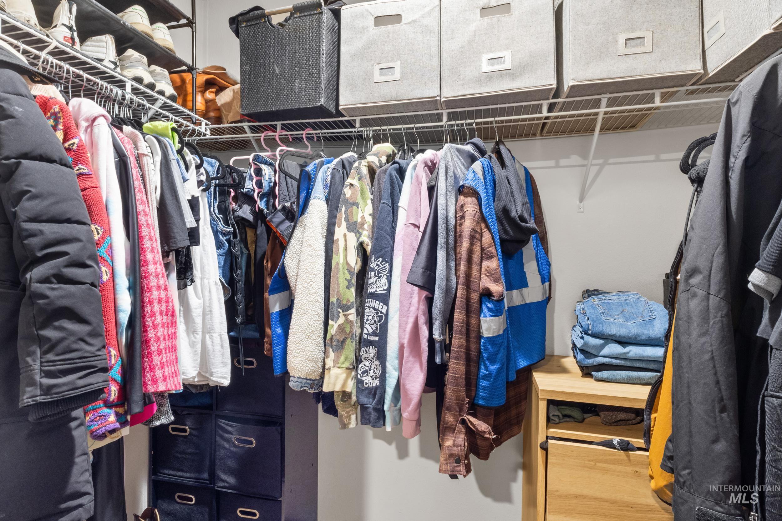Spacious closet featuring wood finished floors