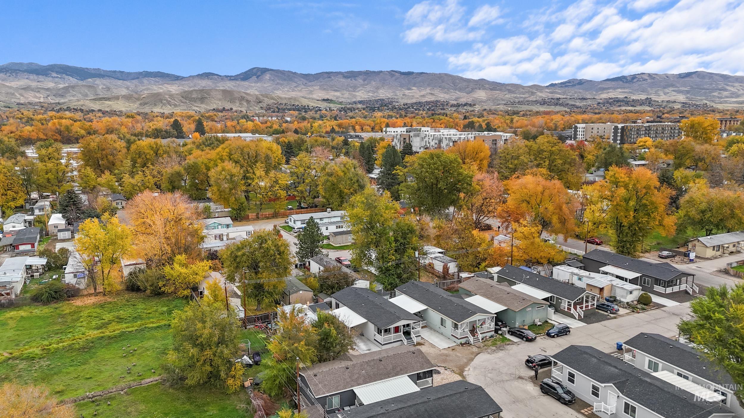 Aerial view of residential area featuring a mountain backdrop